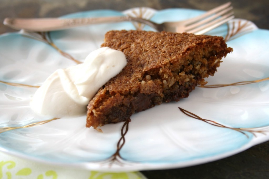 gluten-free chocolate chip cookie pie on a plate with cream